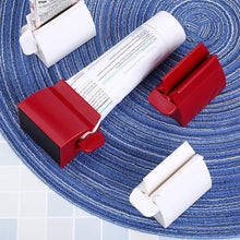 Load image into Gallery viewer, Rolling Tube Toothpaste Squeezer Toothpaste Holder Stand