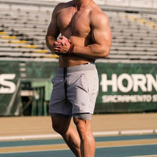 Load image into Gallery viewer, Quick-Dry Elastic Shorts For Men
